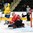 GRAND FORKS, NORTH DAKOTA - APRIL 23: Canada's Evan Fitzpatrick #1 makes a glove save while Sweden's Isac Lundestrom #17 looks on during semifinal round action at the 2016 IIHF Ice Hockey U18 World Championship. (Photo by Minas Panagiotakis/HHOF-IIHF Images)

